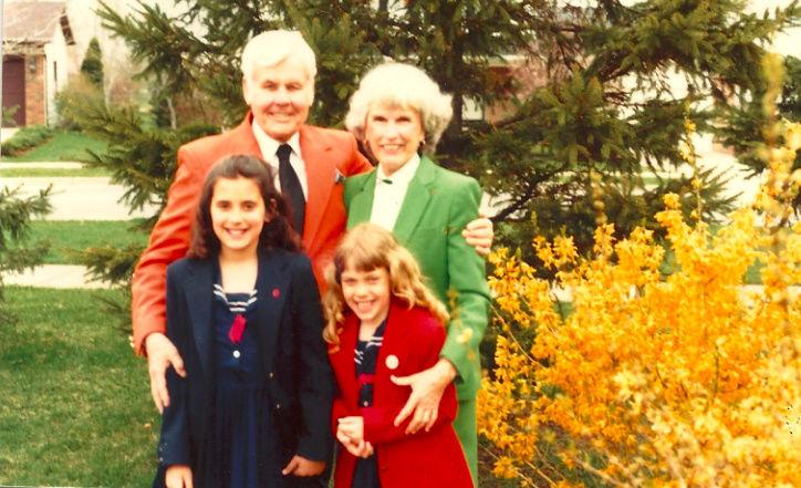 Gretchen Whitmer (lower left) stands with her grandparents, Dana Whitmer (left) and Esther Whitmer (right) along with her sister.