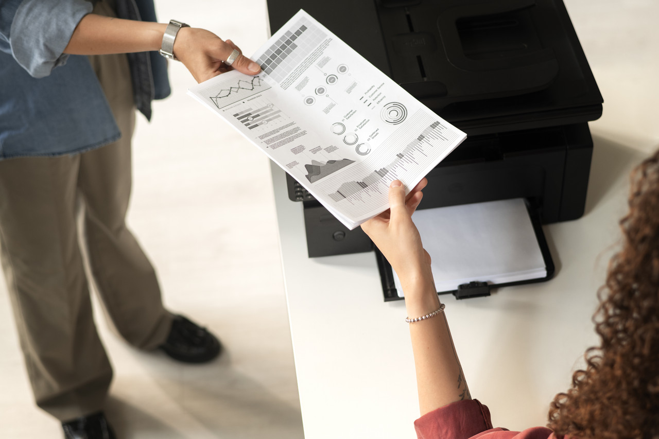 high angle women holding paper