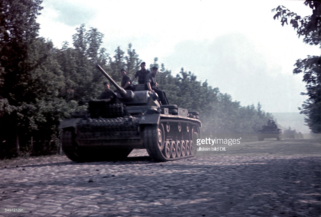 German tanks (pzkfw III) advancing on a road in russia. summer 1