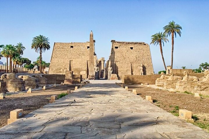 Luxor Temple illuminated at night — riverside temple with obelisk and sphinx avenue, East Bank Luxor