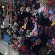 rows of scrunchies, headbands, and hair accessories