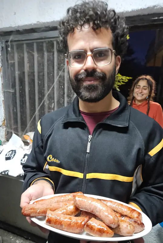 Apostolis with the first batch of sausages