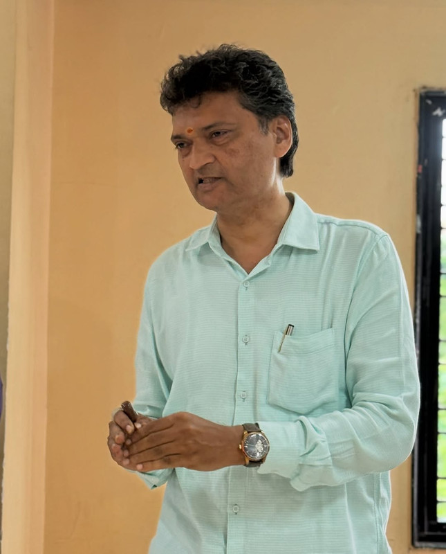 A person confidently speaking at a podium, representing leadership.