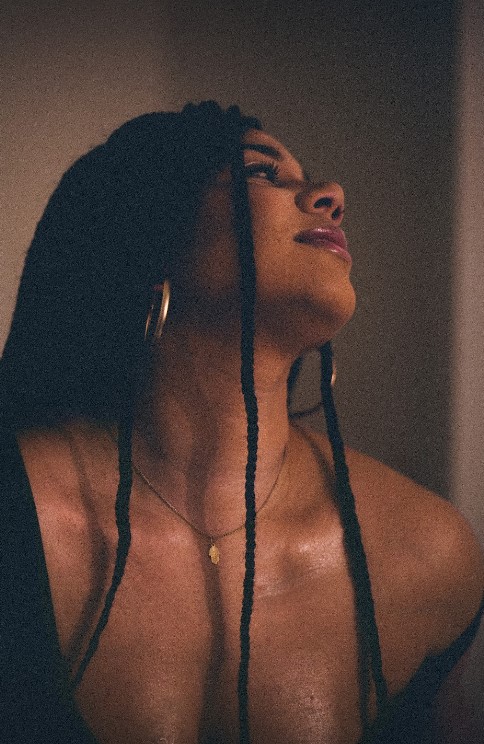beautiful woman looking at the wall