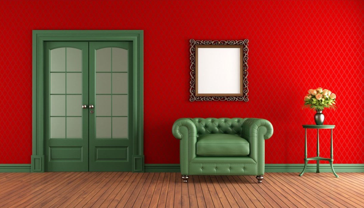 red-walls-green-armchair-in-living-room.jpg