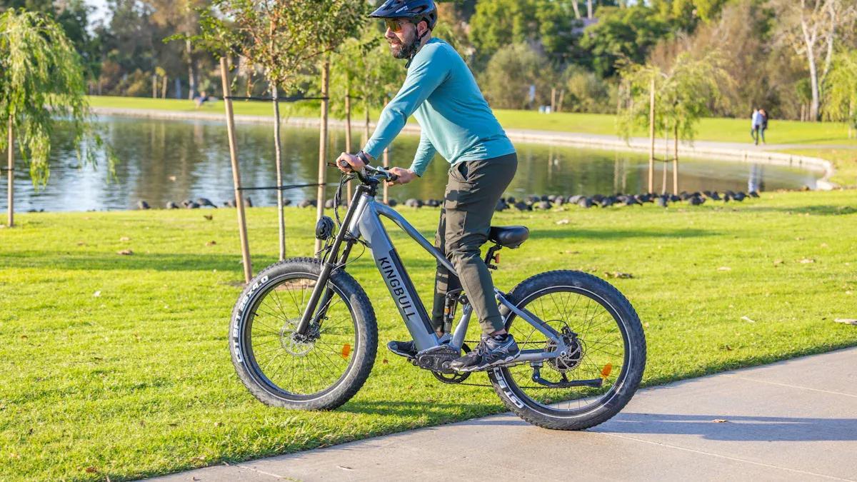 Rider comfortably using a Kingbull fat tire ebike on a paved bike path