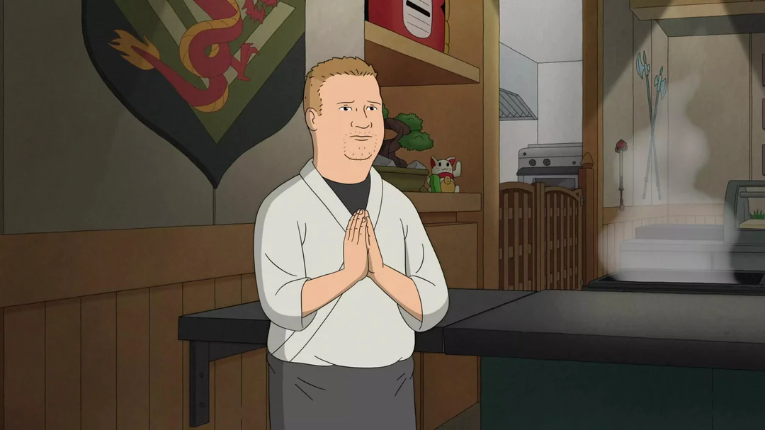 Bobby Hill in his chef outfit standing at the counter.