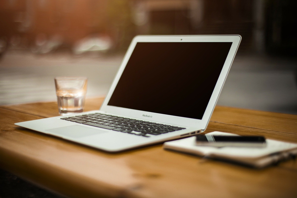 A laptop on a desk.