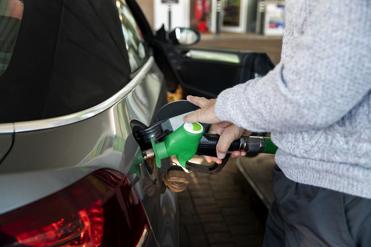 close-up-hand-pumping-gas-car-Easy-Resize-com.jpg