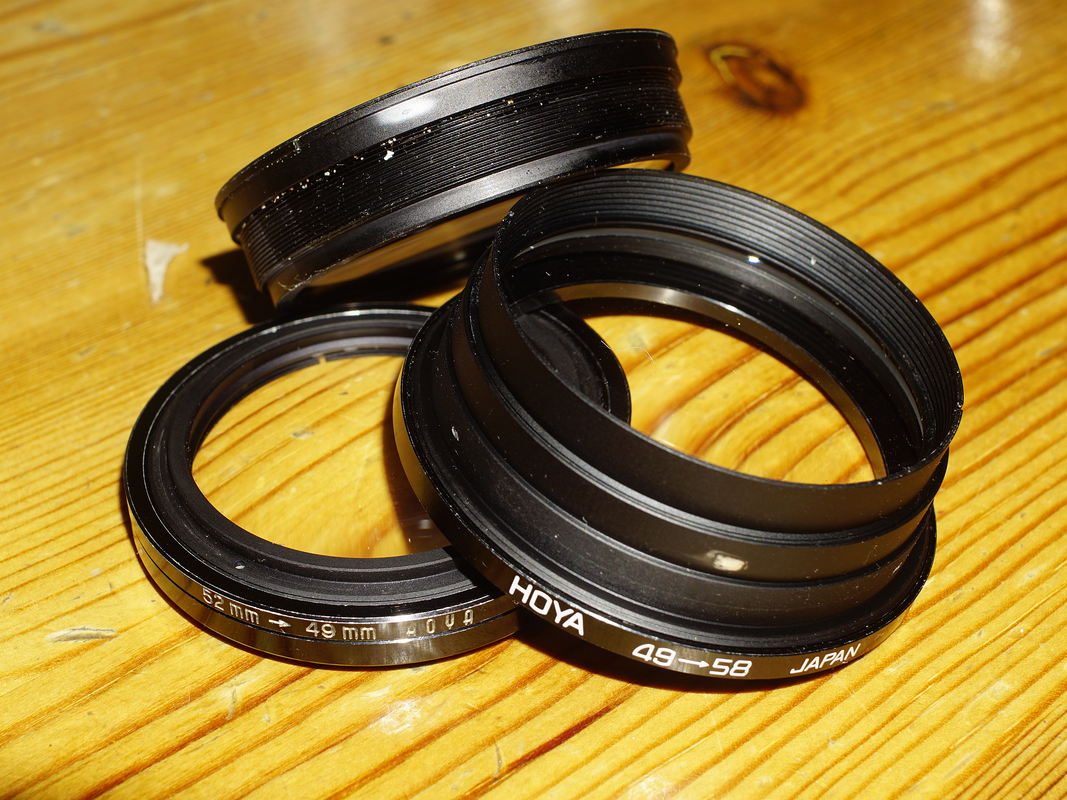 The 58mm Tamron 103A one is facing the 'wrong way' as I don't have the right step rings to hand. Nevertheless, the glass is easily flipped as the retaining ring wasn't obviously glued. Performance has been known to sometimes improve with the 'wrong' orientation of a close-up achro so YMMV. It performs just fine this way.