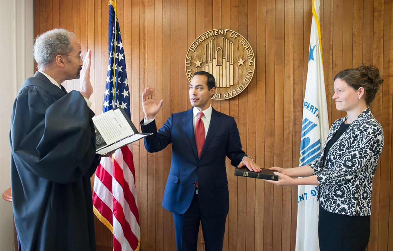 Julian Castro, center, is sworn in as Secretary for the U.S. Department of Housing and Urban Development, in Washington