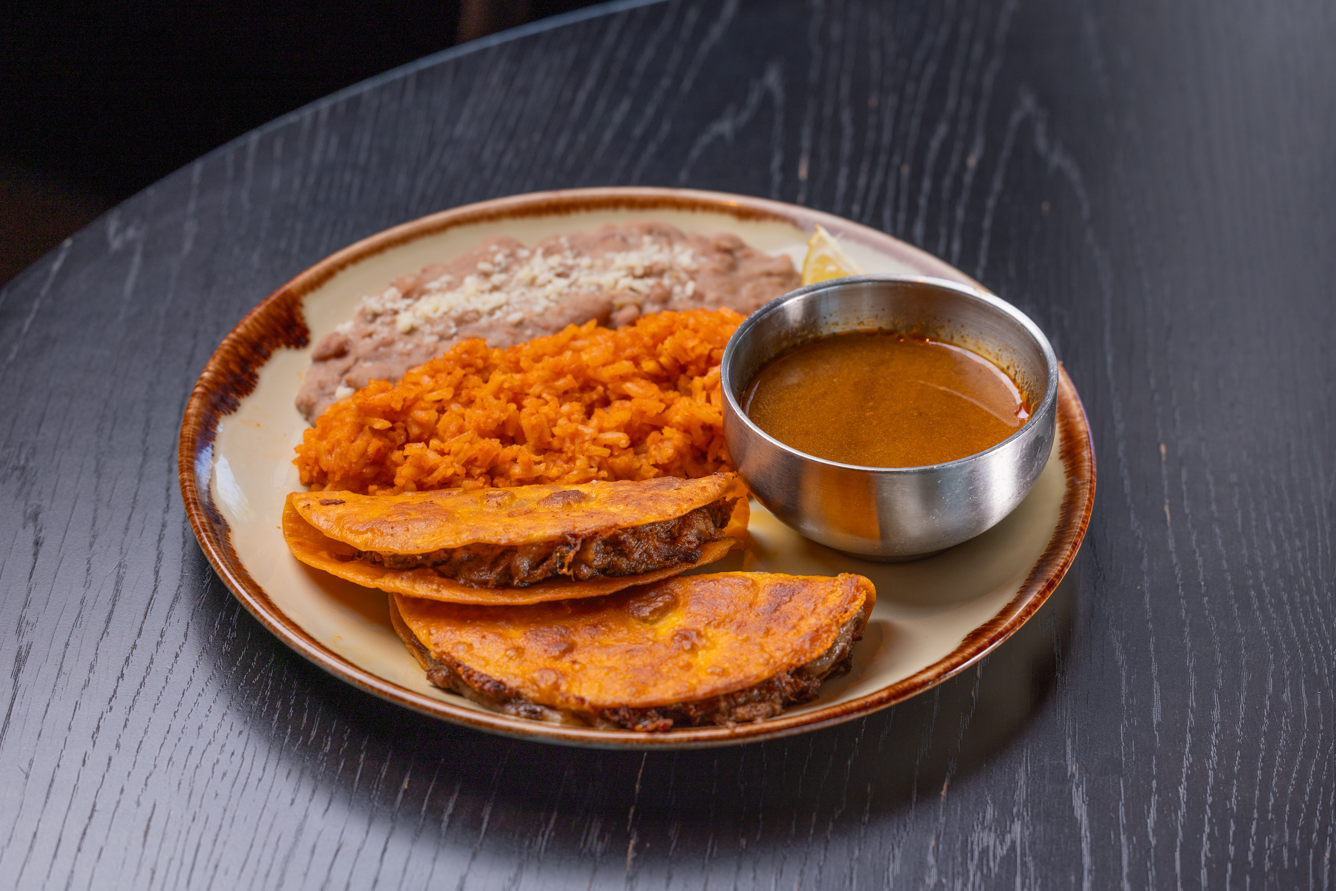 La Popular's signature Quesabirria taco