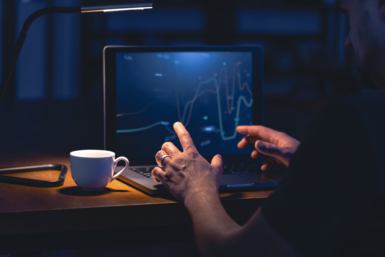 man trading browsing online stock investments night (2)