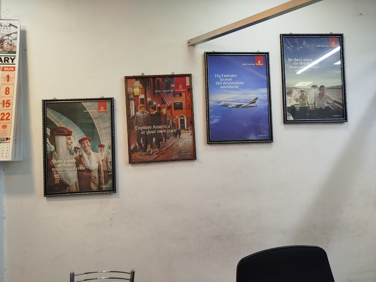 Emirates airline posters framed inside the Sky One office