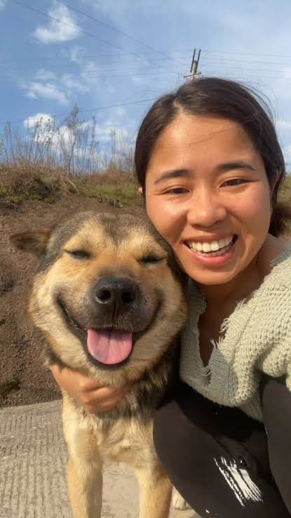 Pet owner with their pet during a grooming or at-home care moment