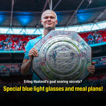Haaland holding a trophy, caption about blue light glasses