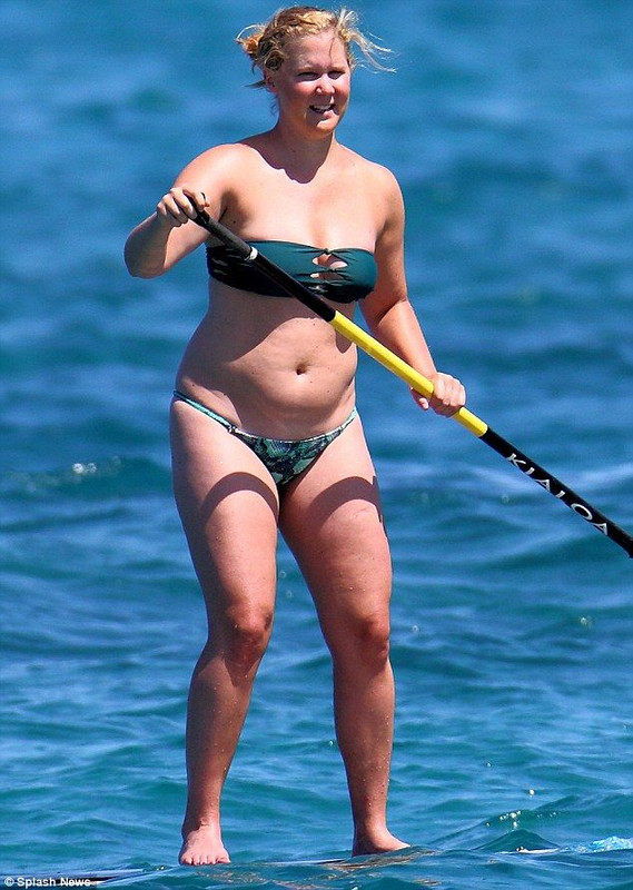 With her slim body and Regular blond hairtype without bra (cup size 36B) on the beach in bikini

