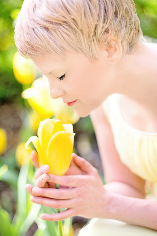yellowflowerladyholding.jpg