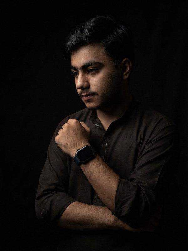 Crossed Arms Smartwatch AI Portrait Prompt | Low-Key Prompt Craft