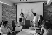A team working together at a presentation