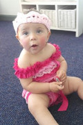 cute-baby-in-her-hot-pink-and-baby-pink-smitten-lace-romper-and-crochet-crown-headband