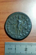 Nummus de Galerio Maximiano. GENIO POPV-LI ROMANI. Genio estante a izq. Trier. 20220208-212953