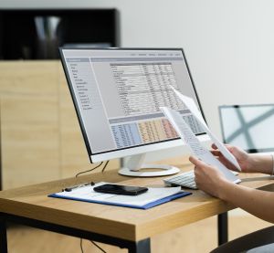 Person Trying To Print Spreadsheet On Computer