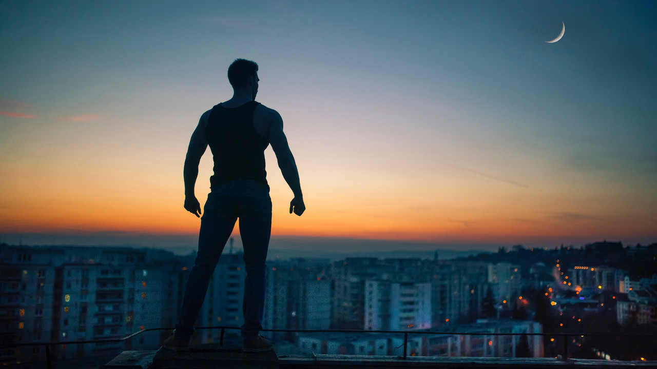 [Image: man-standing-crescent-sunset-back-view.jpg]