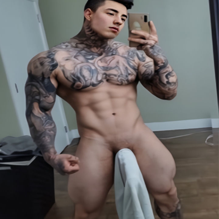 Hot tattooed guy showing off physique