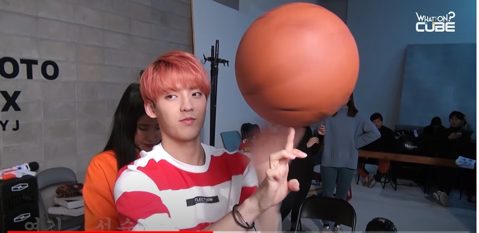 Minhyuk spins a basketball on his finger