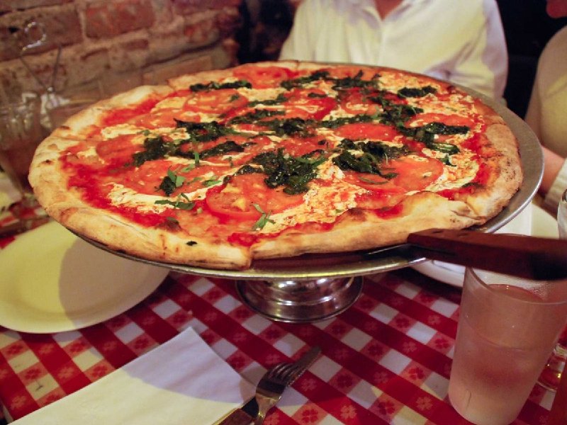 new-york-style-pizza-is-characterized-by-a-puffy-outer-crust-tha.jpg