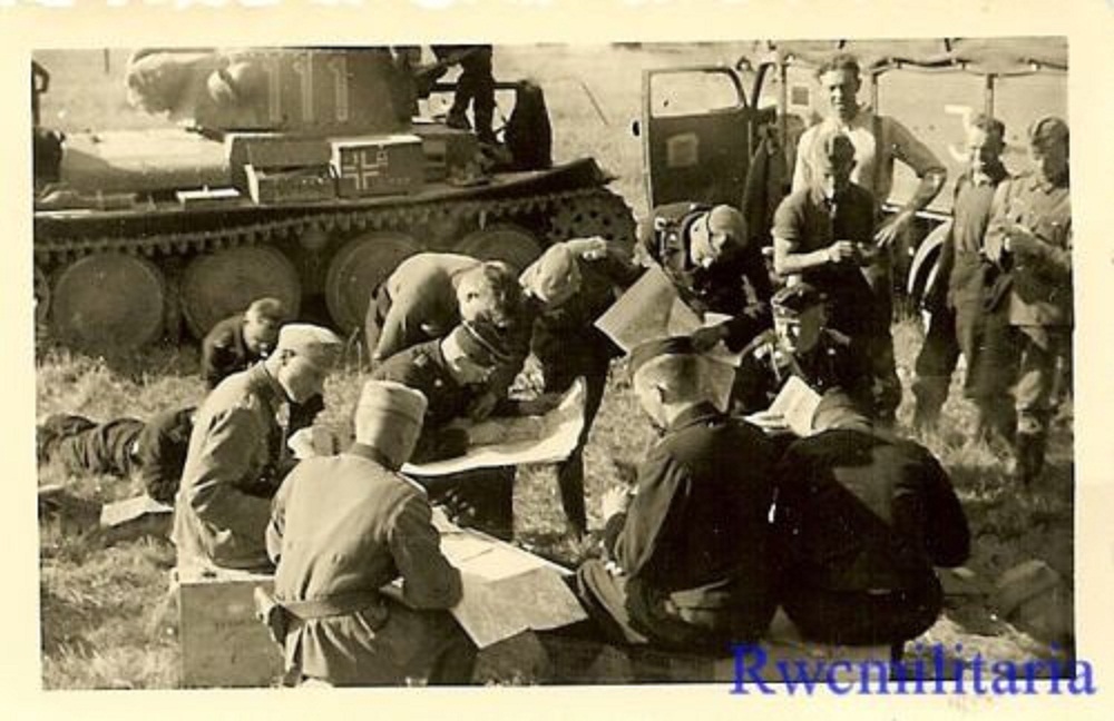 Gathered German Panzer Officers Checking Maps by Pzkw.38(t) Tank