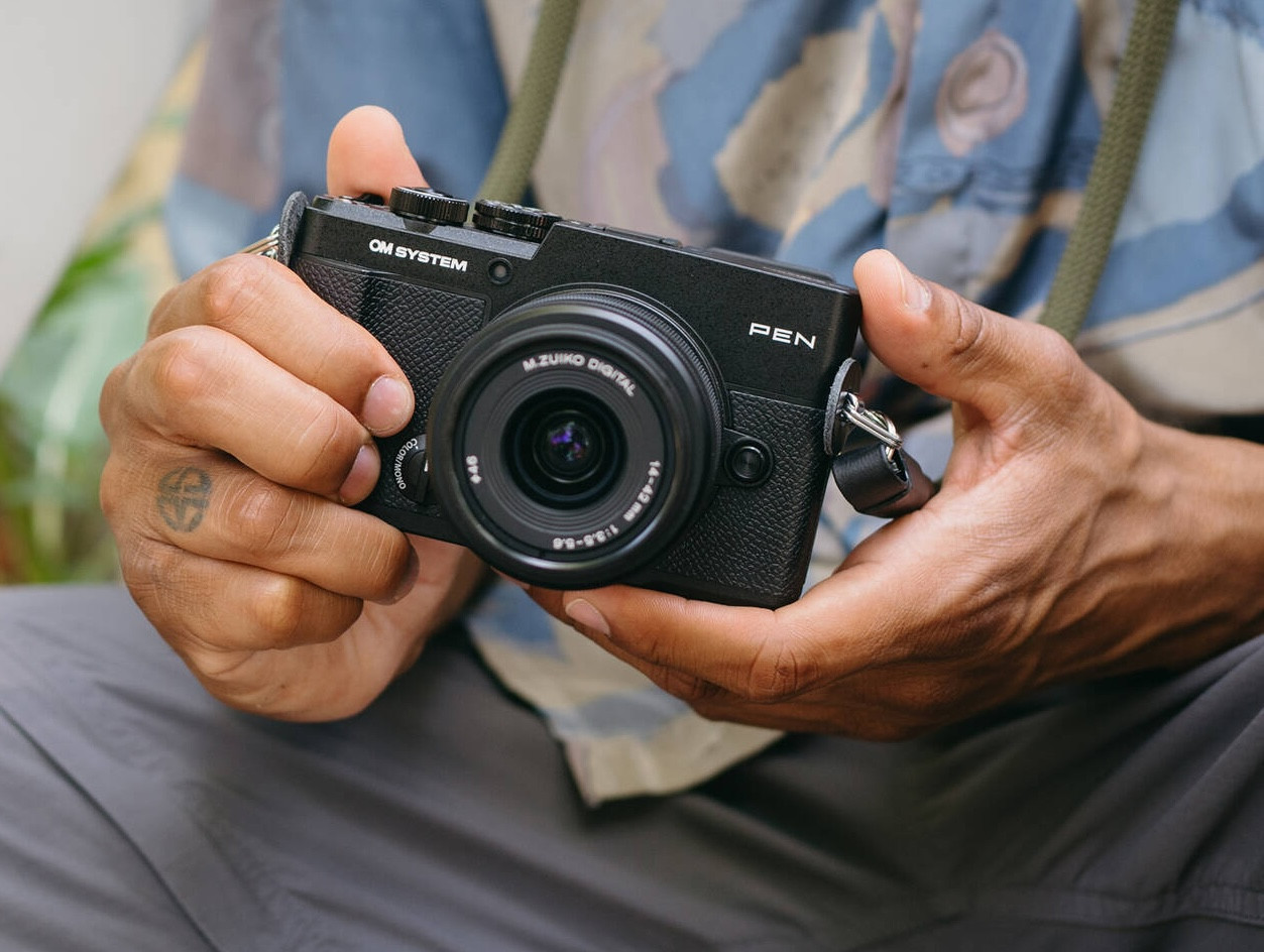 OM SYSTEM PEN Mirrorless Camera lifestyle shot