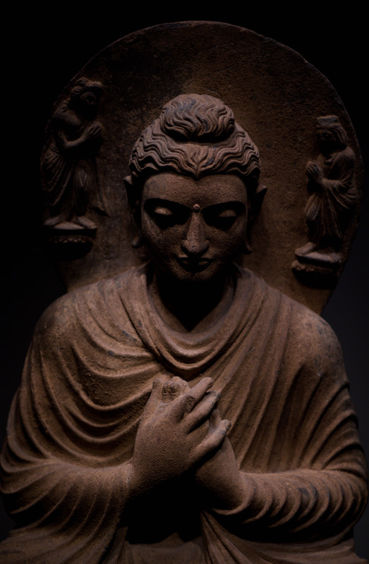 Ancient Buddha statue with ornate details