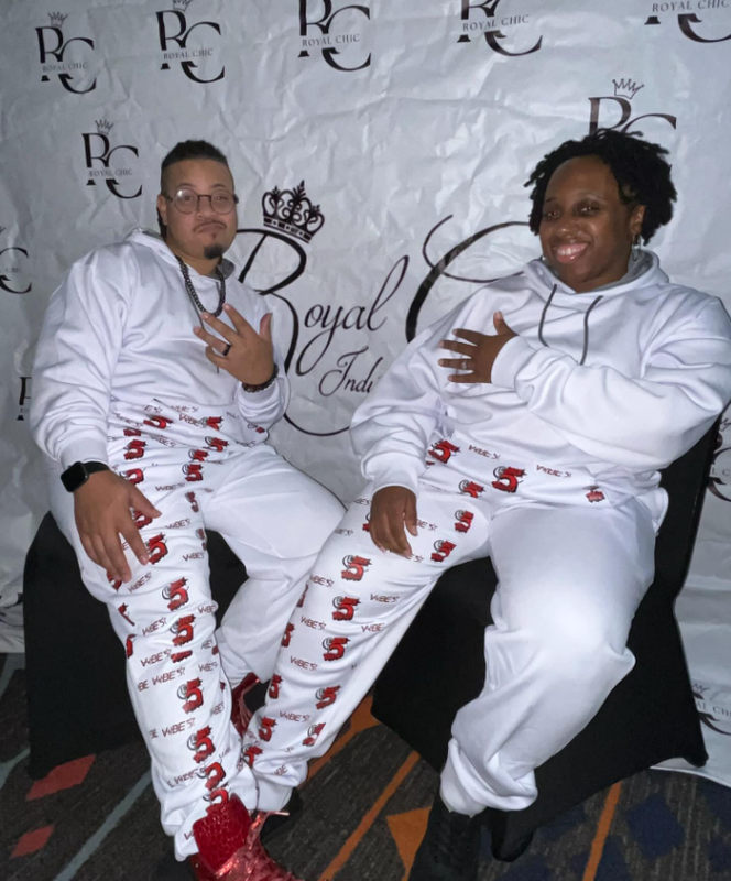 Models in custom matching sweat suits
