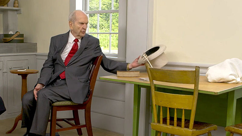 President Russell M. Nelson demonstrates how Joseph Smith translated using a seer stone in his hat
