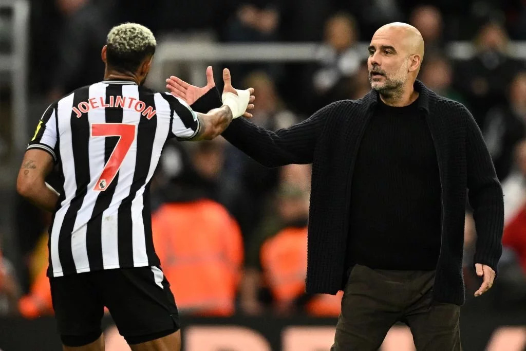 Joelinton and Guardiola during Newcastle vs Manchester City