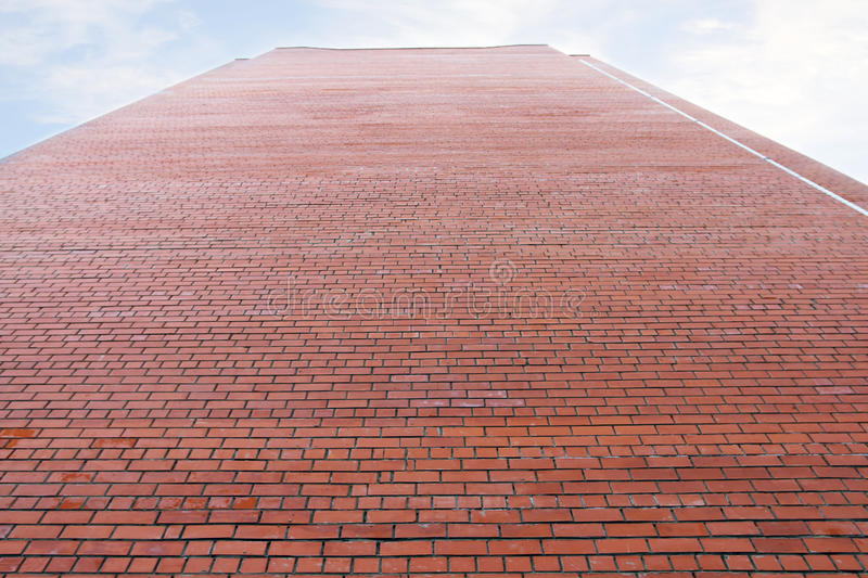 very-high-wall-red-brick-building-cloudy-sky-above-47895475.jpg