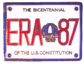 an enamel pin that says says 'THE BICENTENNIAL OF THE U.S. CONSTITUTION' acrosss the top and bottom, with the words 'ERA 87' in the center, separated by a drawing of the liberty bell