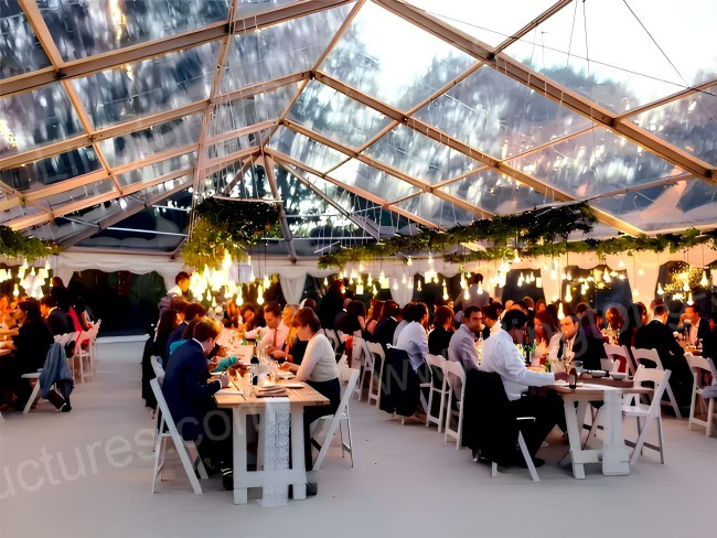 Elegant wedding tent interior with draped ceiling and LED lighting