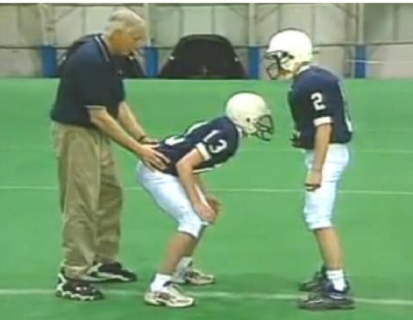 jerry-sandusky-behind-kid-at-practice.jp