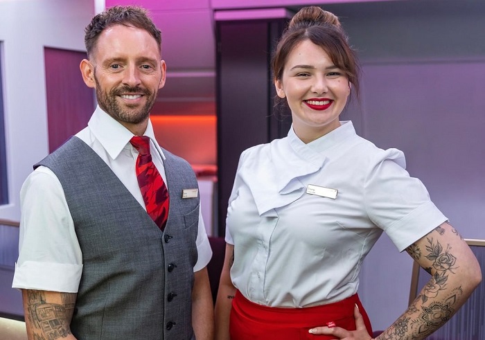 Maskapai Virgin Atlantic telah melonggarkan aturan seragamnya ,kini pramugari dan awak kabin dapat memperlihatkan tato selain yang berada di wajah dan leher selagi bertugas.