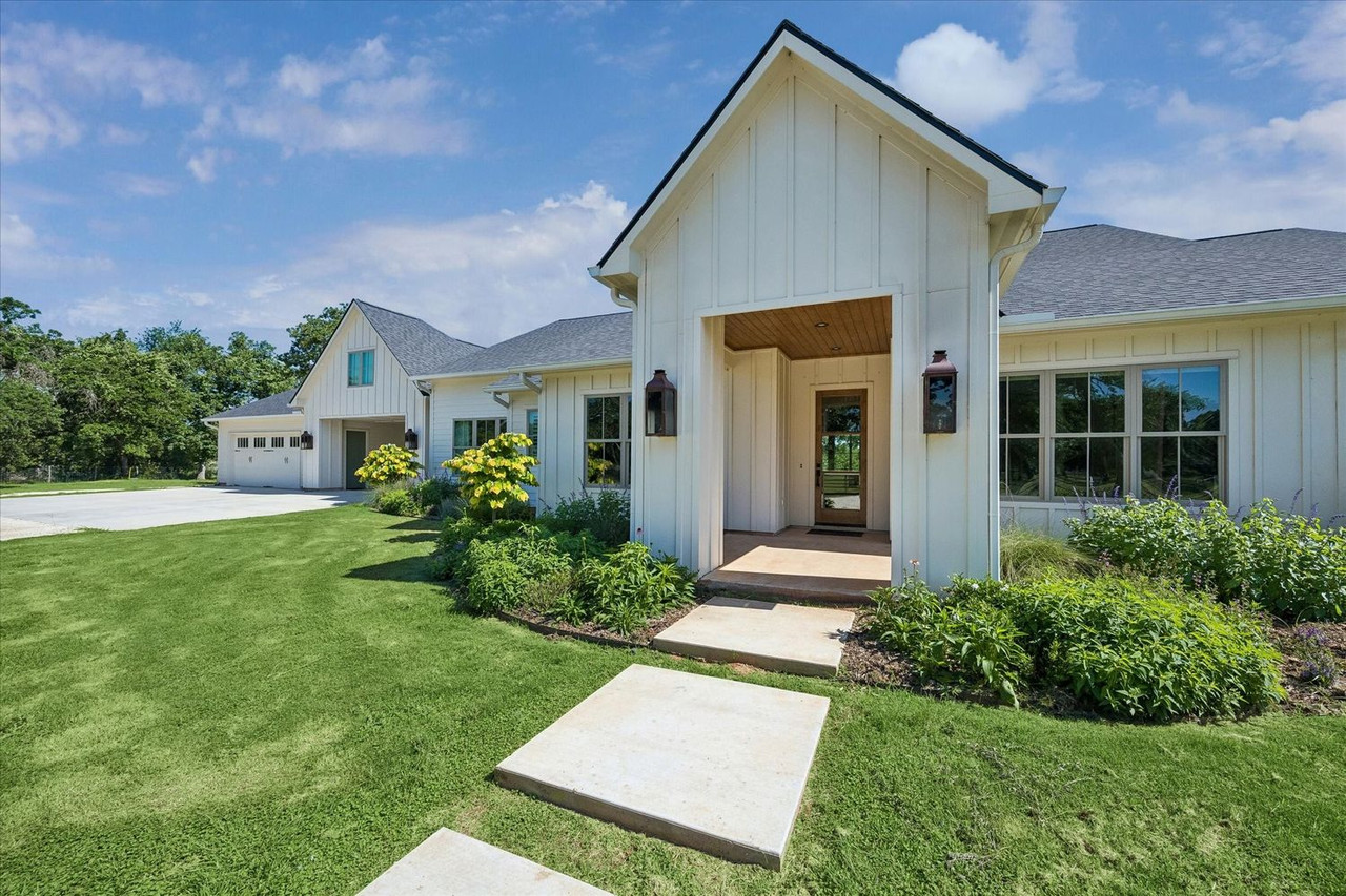 4052 Kuykendall Road luxury estate in Bellville Texas with landscaped grounds and custom residence
