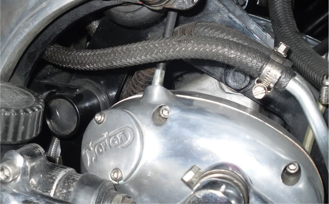 Original and new oil junction block.