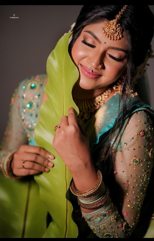 Creative bridal portrait with green leaf