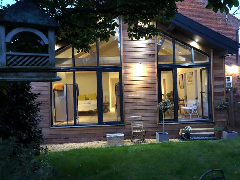 Dirty yard with construction debris and garbage trucks