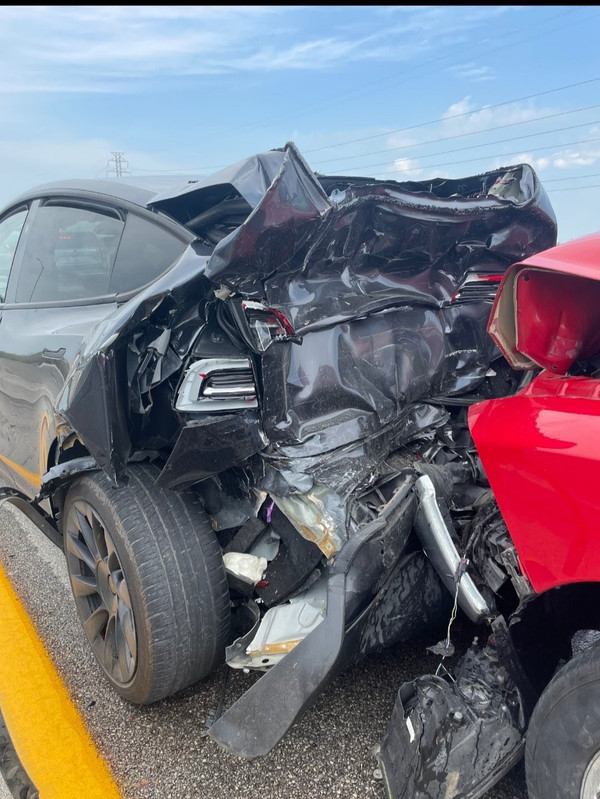 Tesla wreck w Red truck 1