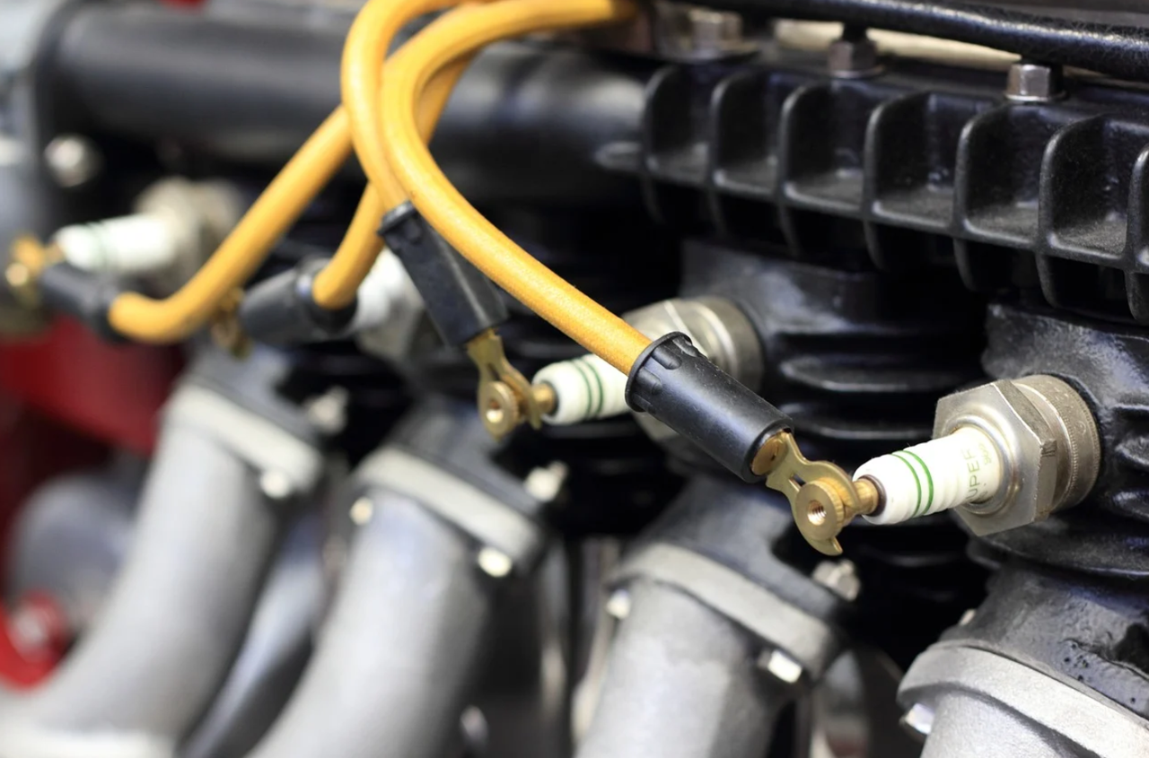 Spark plugs with ignition wires on car engine