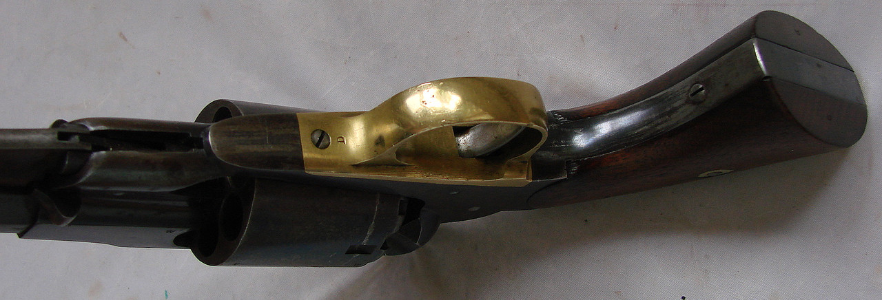 The trigger guard screw on the 58 Remington Army