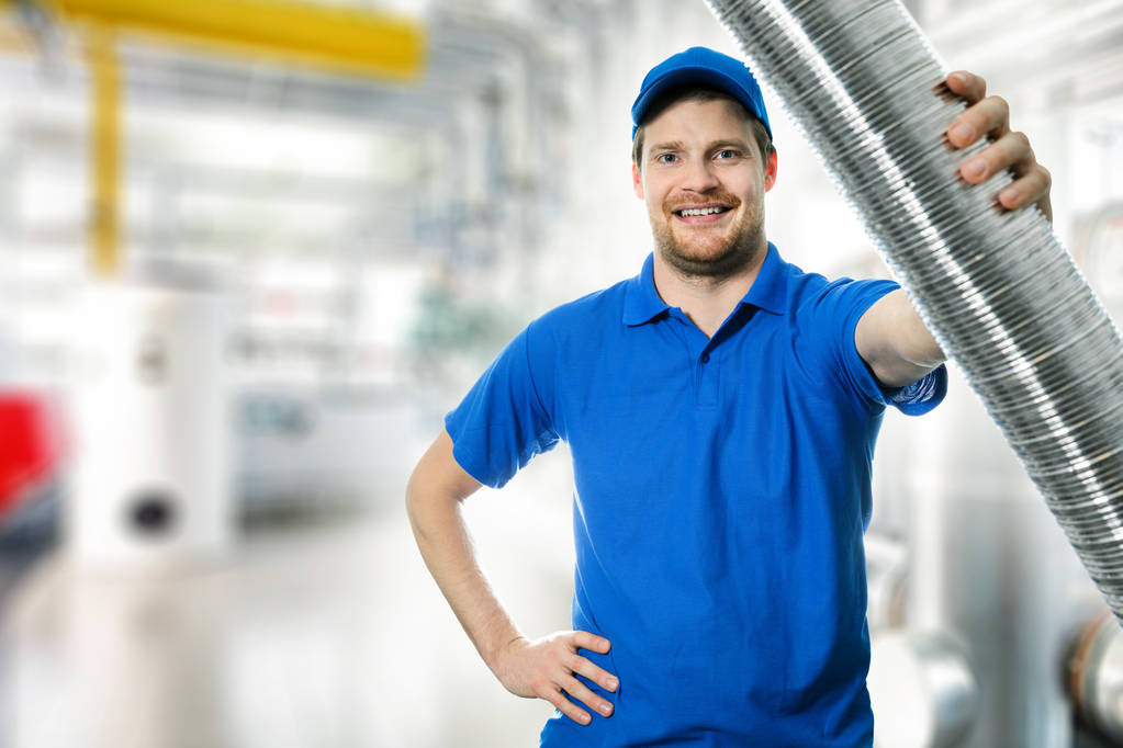 HVAC technician working with aluminum ducting